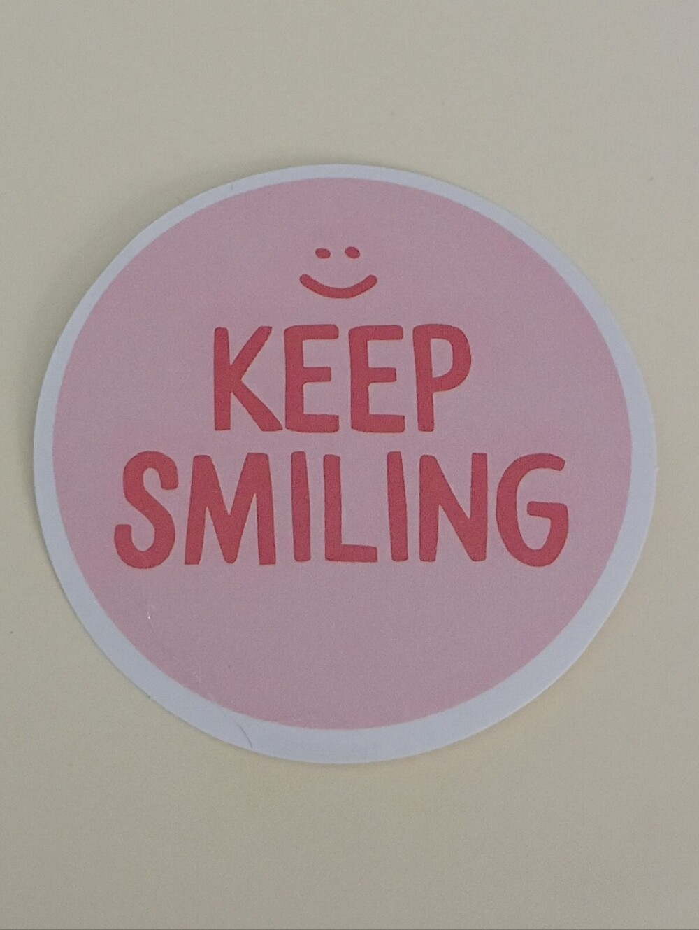 10/$10 Sticker - Keep Smiling - Pink Circle With Red Text & Smiley Face